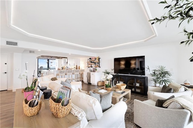 300 Lake Marina Ave Unit 14Dbw, New Orleans, LA 70124 - living room featuring wood finished floors and a raised ceiling