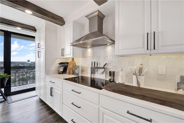 300 Lake Marina Ave Unit 14Dbw, New Orleans, LA 70124 - kitchen with wall chimney range hood, black electric cooktop, expansive windows, backsplash, and white cabinets