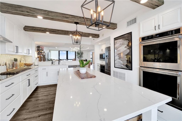 300 Lake Marina Ave Unit 14Dbw, New Orleans, LA 70124 - kitchen with stainless steel appliances, a chandelier, white cabinetry, tasteful backsplash, and beamed ceiling