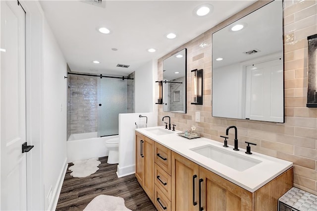 300 Lake Marina Ave Unit 14Dbw, New Orleans, LA 70124 - bathroom with double vanity, shower / tub combination, tasteful backsplash, wood finished floors, and recessed lighting