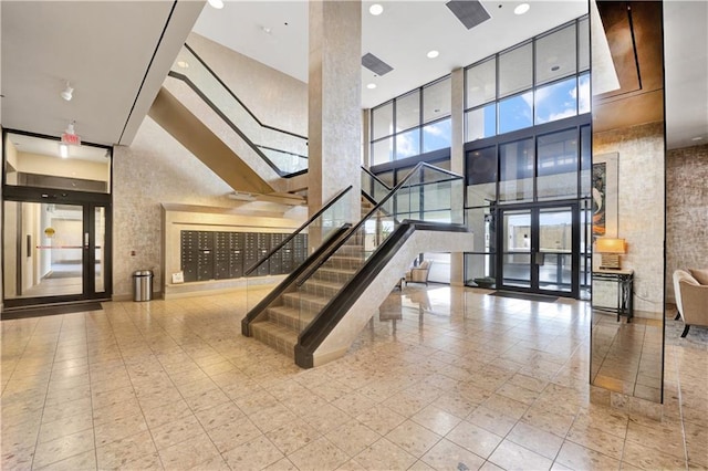 300 Lake Marina Ave Unit 14Dbw, New Orleans, LA 70124 - community lobby featuring a towering ceiling, stairs, and recessed lighting