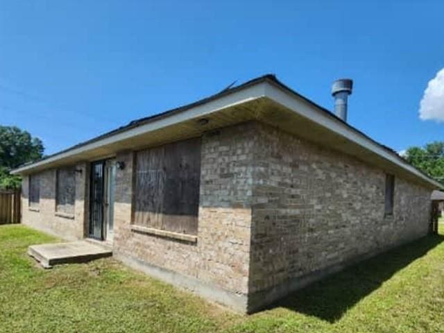 108 E 12th Ext, Reserve, LA 70084 - view of side of property featuring a lawn