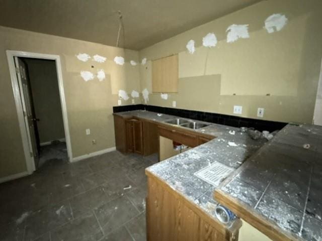 108 E 12th Ext, Reserve, LA 70084 - kitchen featuring a sink and a peninsula