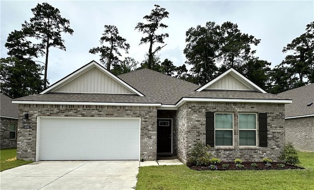 42423 Landing View Rd, Ponchatoula, LA 70454 - view of front of house with board and batten siding, driveway, a garage, and brick siding