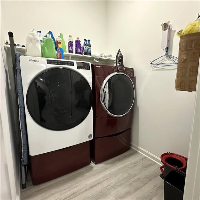 42423 Landing View Rd, Ponchatoula, LA 70454 - washroom featuring washing machine and dryer and light wood-style floors