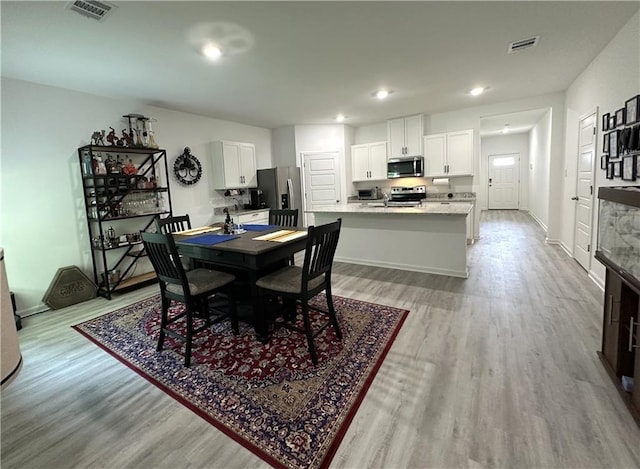 42423 Landing View Rd, Ponchatoula, LA 70454 - dining area featuring light wood finished floors and recessed lighting