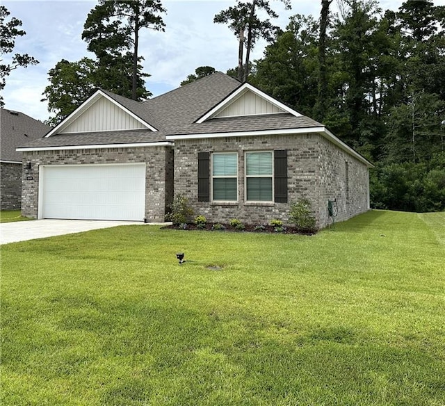 42423 Landing View Rd, Ponchatoula, LA 70454 - view of front of home featuring concrete driveway, a shingled roof, a garage, and a front yard