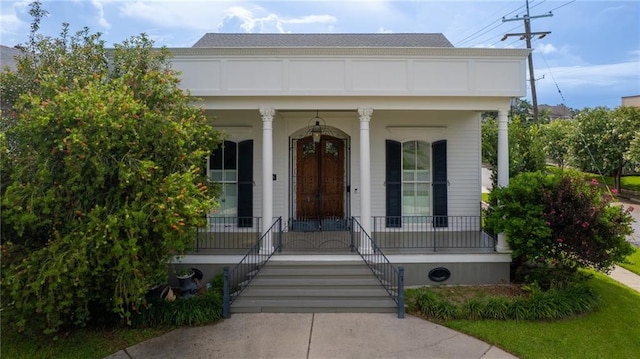 6978 Canal Blvd, New Orleans, LA 70124 - doorway to property featuring covered porch