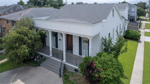6978 Canal Blvd, New Orleans, LA 70124 - view of front facade featuring a porch and a shingled roof