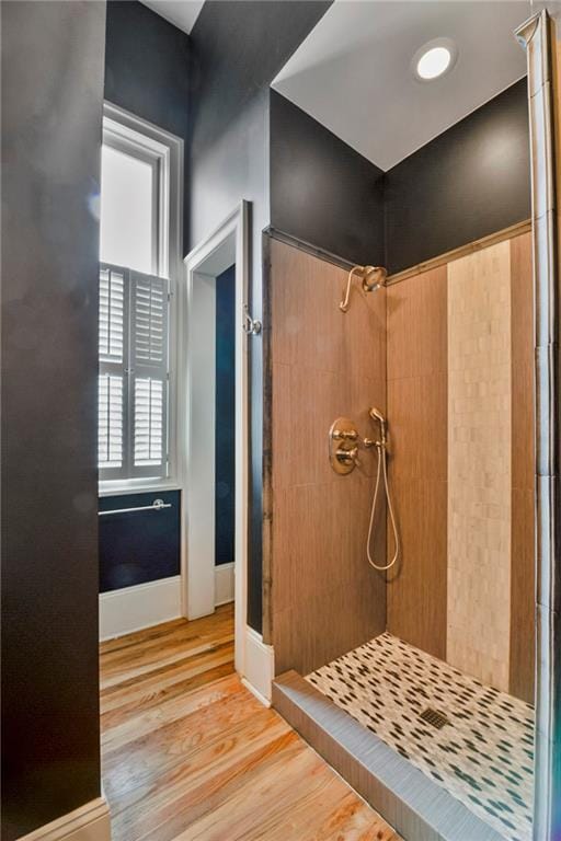 6978 Canal Blvd, New Orleans, LA 70124 - bathroom featuring a stall shower and wood finished floors