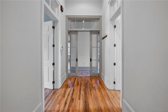 6978 Canal Blvd, New Orleans, LA 70124 - hall featuring wood finished floors and french doors