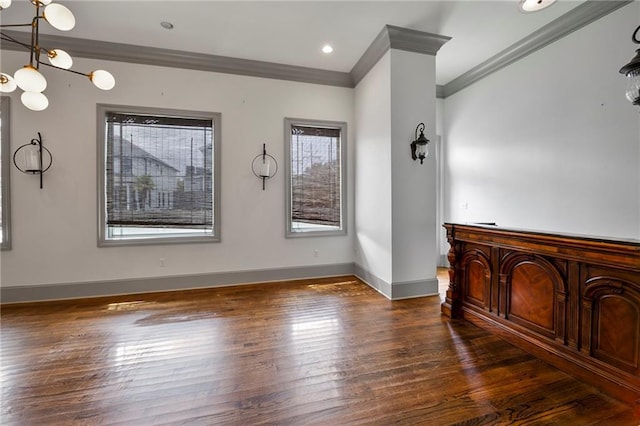 6978 Canal Blvd, New Orleans, LA 70124 - unfurnished living room with plenty of natural light, crown molding, wood finished floors, and a chandelier