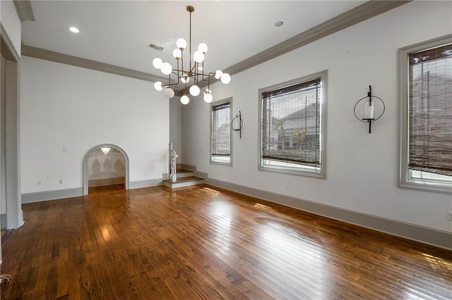 6978 Canal Blvd, New Orleans, LA 70124 - unfurnished living room featuring healthy amount of natural light, wood-type flooring, a chandelier, crown molding, and recessed lighting