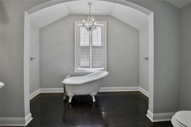 6978 Canal Blvd, New Orleans, LA 70124 - bathroom with a freestanding bath, a chandelier, wood finished floors, and lofted ceiling