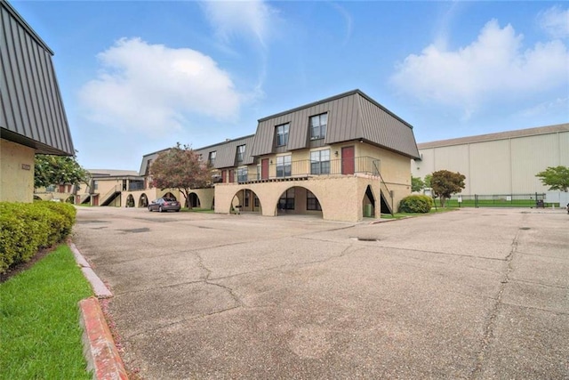 10286 W Winston Ave Unit 15, Baton Rouge, LA 70809 - view of property featuring uncovered parking