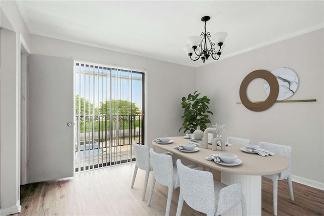 10286 W Winston Ave Unit 15, Baton Rouge, LA 70809 - dining space featuring a chandelier, wood finished floors, and crown molding