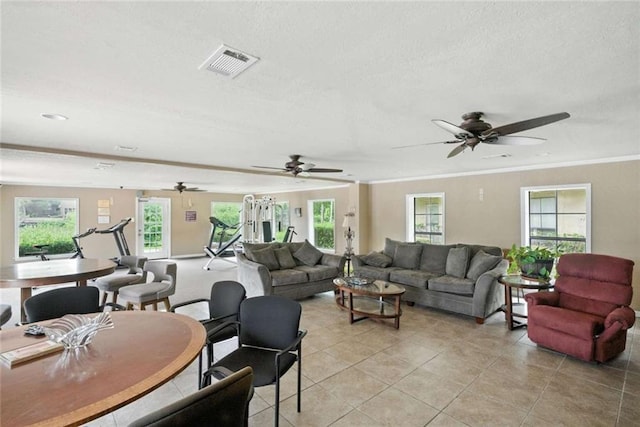 10286 W Winston Ave Unit 15, Baton Rouge, LA 70809 - living area featuring plenty of natural light, ceiling fan, light tile patterned floors, crown molding, and a textured ceiling