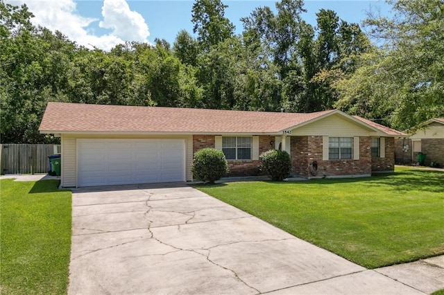 3542 Peachtree St, Slidell, LA 70458 - ranch-style home featuring concrete driveway, a garage, and brick siding