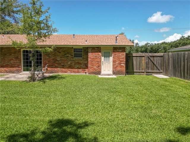 3542 Peachtree St, Slidell, LA 70458 - rear view of house with brick siding and a gate