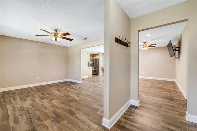 3542 Peachtree St, Slidell, LA 70458 - hallway featuring wood finished floors, a textured ceiling, and recessed lighting