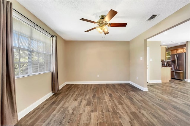 3542 Peachtree St, Slidell, LA 70458 - unfurnished room featuring a ceiling fan, wood finished floors, and a textured ceiling