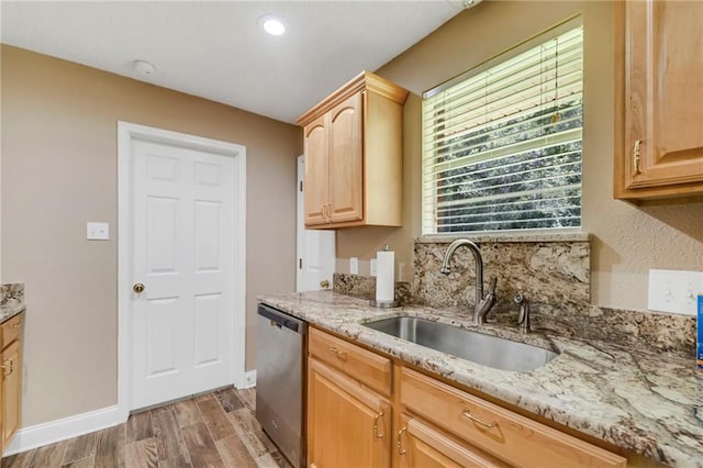 3542 Peachtree St, Slidell, LA 70458 - kitchen with stainless steel dishwasher, light brown cabinets, light wood finished floors, and light stone counters