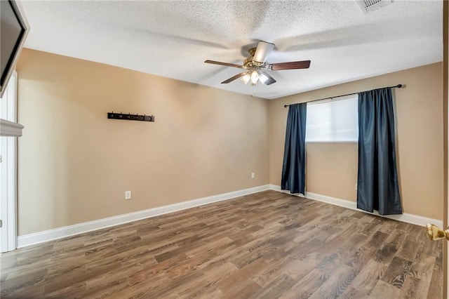 3542 Peachtree St, Slidell, LA 70458 - unfurnished room with a ceiling fan, wood finished floors, and a textured ceiling