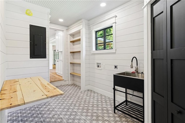 72287 Military Rd, Covington, LA 70435 - bathroom with electric panel, wood walls, tile patterned floors, and recessed lighting