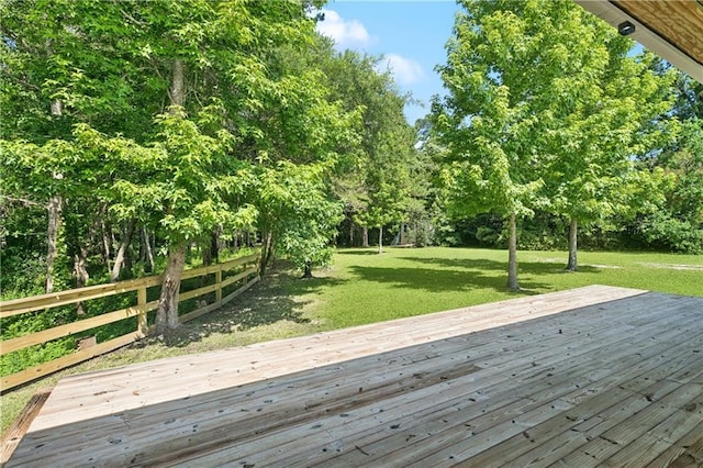 72287 Military Rd, Covington, LA 70435 - wooden deck featuring a lawn and view of wooded area