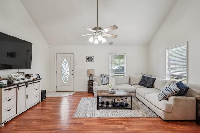 70105 10th St, Covington, LA 70433 - living room featuring vaulted ceiling, wood finished floors, and a ceiling fan