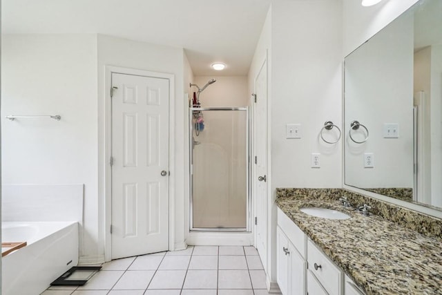 70105 10th St, Covington, LA 70433 - full bath with a stall shower, vanity, tile patterned flooring, and a garden tub