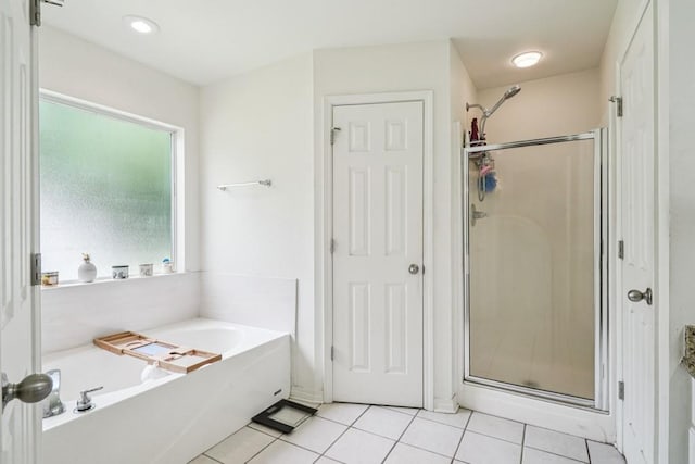 70105 10th St, Covington, LA 70433 - full bathroom with a bath, a shower stall, and tile patterned floors