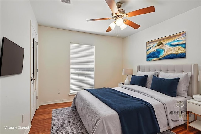 70105 10th St, Covington, LA 70433 - bedroom with wood finished floors and a ceiling fan