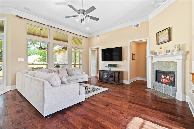 412 Aspen Ln, Covington, LA 70433 - living room featuring ceiling fan, crown molding, dark wood-style floors, and a fireplace