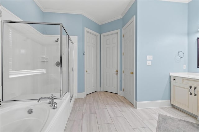412 Aspen Ln, Covington, LA 70433 - bathroom featuring vanity, a shower stall, a garden tub, and ornamental molding