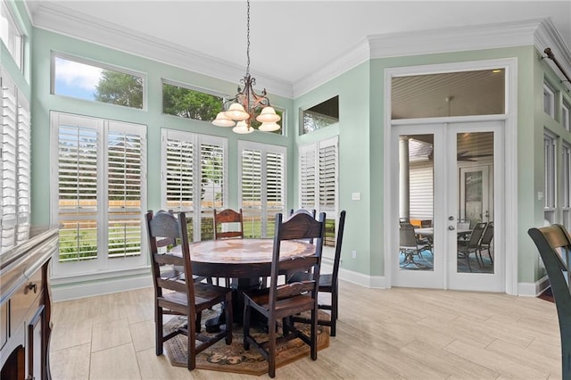 412 Aspen Ln, Covington, LA 70433 - dining space featuring french doors, a chandelier, crown molding, light wood-style floors, and healthy amount of natural light