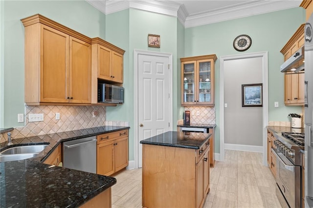 412 Aspen Ln, Covington, LA 70433 - kitchen featuring stainless steel appliances, crown molding, under cabinet range hood, decorative backsplash, and dark stone countertops