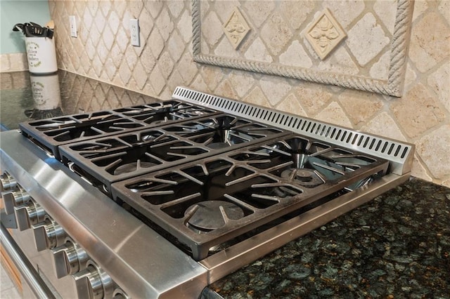 412 Aspen Ln, Covington, LA 70433 - kitchen view of stainless steel range and decorative backsplash