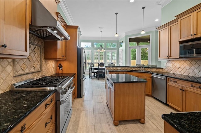 412 Aspen Ln, Covington, LA 70433 - kitchen with stainless steel appliances, ventilation hood, backsplash, dark stone countertops, and ornamental molding