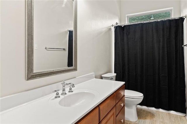 412 Aspen Ln, Covington, LA 70433 - full bath featuring vanity, wood finished floors, and a shower with curtain
