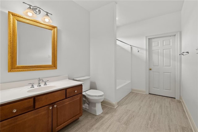 412 Aspen Ln, Covington, LA 70433 - bathroom featuring vanity, wood finished floors, and tub / shower combination