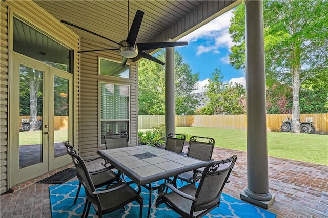 412 Aspen Ln, Covington, LA 70433 - fenced backyard featuring french doors, ceiling fan, a patio, and outdoor dining area