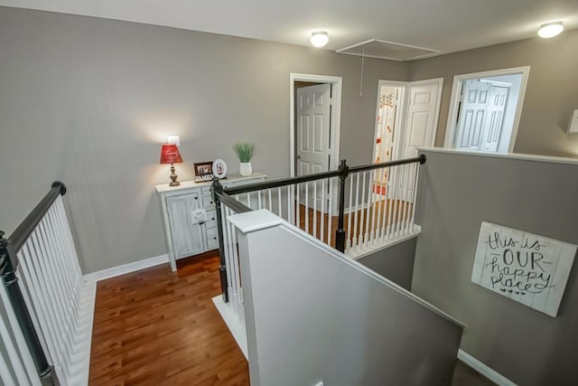784 Lakeview Ln, Covington, LA 70435 - corridor featuring an upstairs landing, attic access, and dark wood-style flooring
