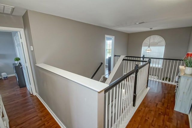 784 Lakeview Ln, Covington, LA 70435 - corridor with an upstairs landing and wood finished floors