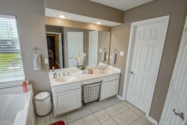 784 Lakeview Ln, Covington, LA 70435 - full bathroom with double vanity, a bath, and tile patterned floors