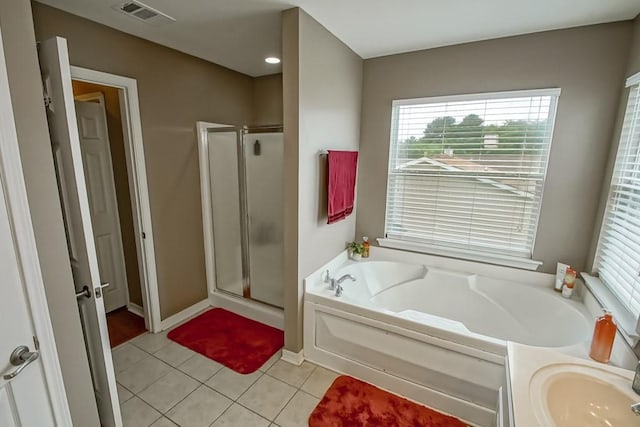 784 Lakeview Ln, Covington, LA 70435 - full bathroom with a garden tub, a shower stall, tile patterned flooring, and healthy amount of natural light