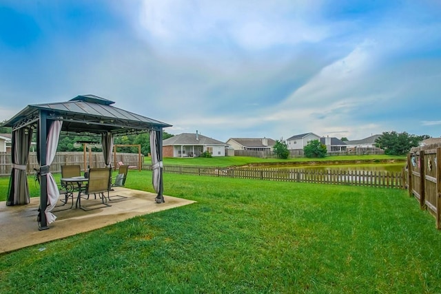 784 Lakeview Ln, Covington, LA 70435 - fenced backyard featuring a gazebo, a patio, a water view, and a residential view