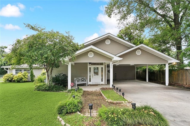 540 N 8th St, Ponchatoula, LA 70454 - ranch-style house with concrete driveway, an attached carport, and a porch