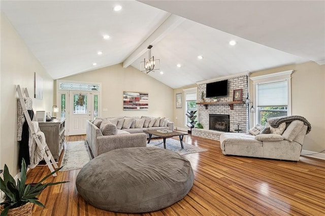 540 N 8th St, Ponchatoula, LA 70454 - living area with a fireplace, light wood-style floors, a chandelier, and recessed lighting