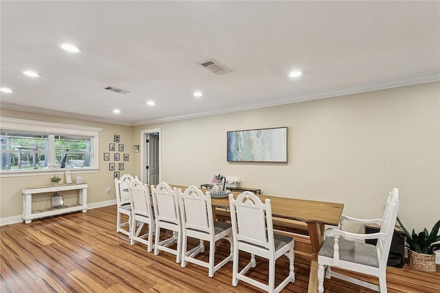 540 N 8th St, Ponchatoula, LA 70454 - dining area featuring crown molding, recessed lighting, and light wood finished floors